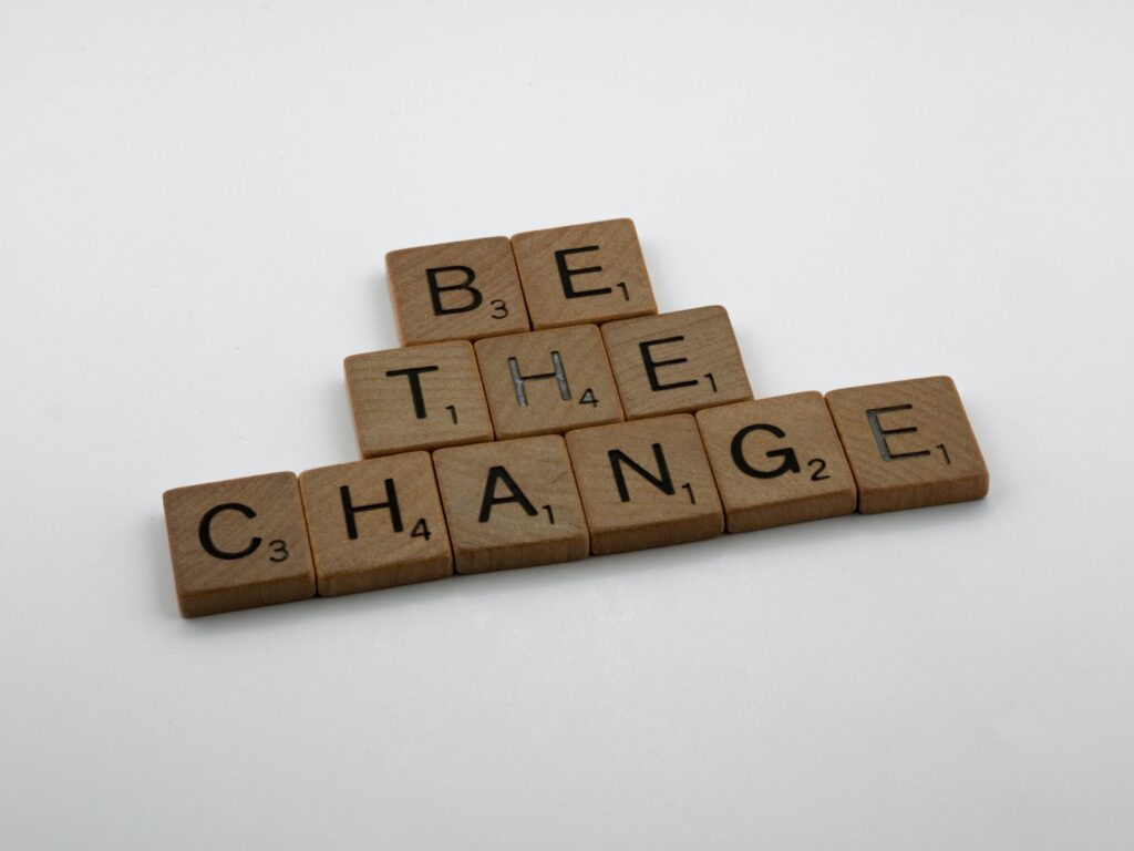 Scrabble tiles that spell Be The Change