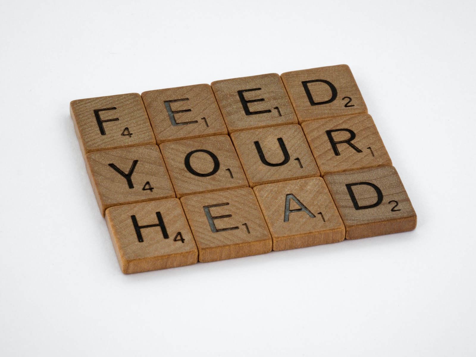 Scrabble tiles spelling Feed Your Head